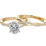 Oval moissanite engagement ring with matching twisted infinity wedding band Duo Collection ApolloGem.