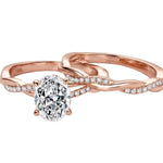 Oval moissanite engagement ring with matching twisted infinity wedding band Duo Collection ApolloGem.