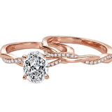 Oval moissanite engagement ring with matching twisted infinity wedding band Duo Collection ApolloGem.
