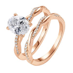 Detailed side view of the Oval Duo Infinity set showing the intertwined pavé gold bands.