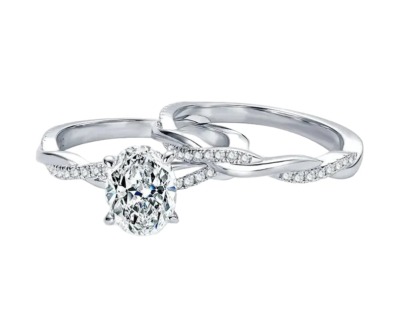 Oval moissanite engagement ring with matching twisted infinity wedding band Duo Collection ApolloGem.
