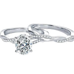 Oval moissanite engagement ring with matching twisted infinity wedding band Duo Collection ApolloGem.