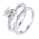 Detailed side view of the Oval Duo Infinity set showing the intertwined pavé gold bands.