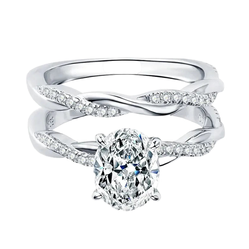 Close-up of a D-color VVS1 oval moissanite in a micro-pavé twisted bridal setting.