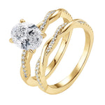 Detailed side view of the Oval Duo Infinity set showing the intertwined pavé gold bands.