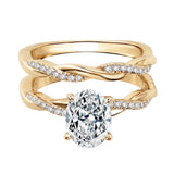 Close-up of a D-color VVS1 oval moissanite in a micro-pavé twisted bridal setting.