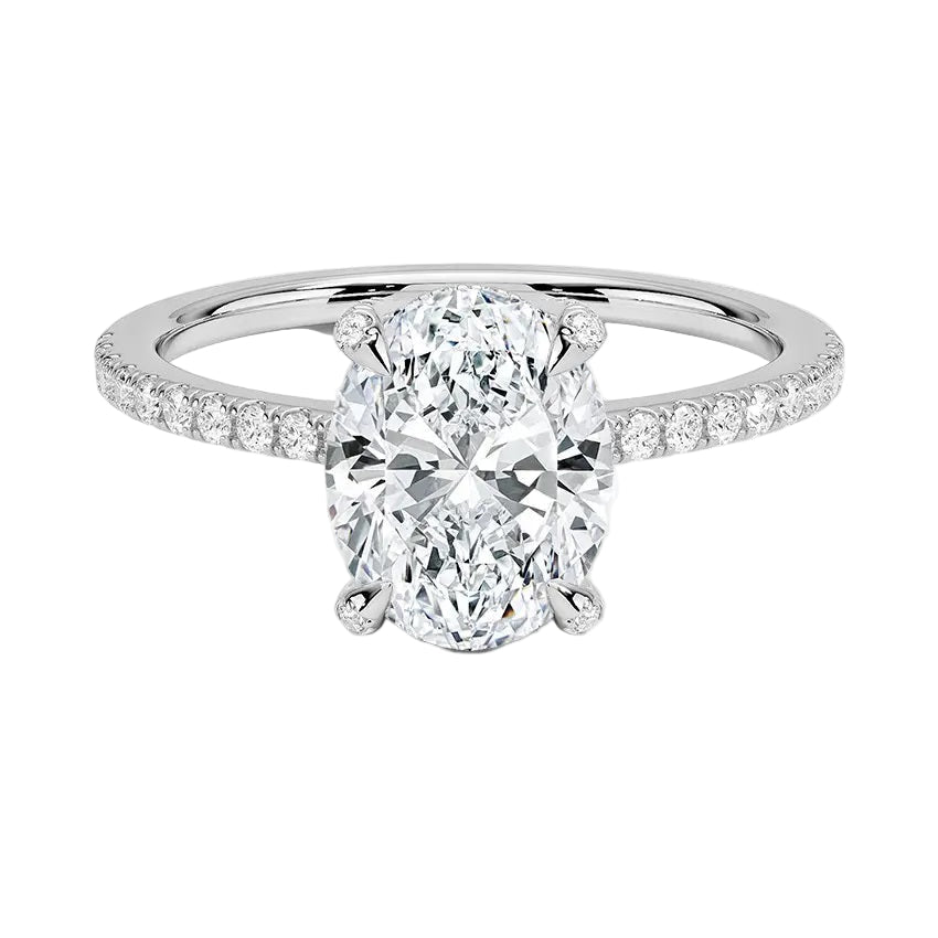 Dainty four-claw oval moissanite ring with hidden halo and encrusted prongs in white gold ApolloGem.