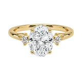 Luxury oval cut moissanite engagement ring in solid 18k yellow gold featuring a classic three-stone design with round brilliant accents ApolloGem South Africa