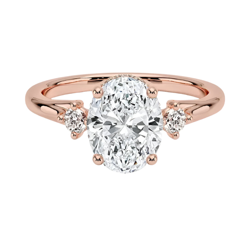 Elegant oval trilogy moissanite ring on a finger showing the elongating effect and sophisticated sparkle of a multi-stone wedding band for modern brides.