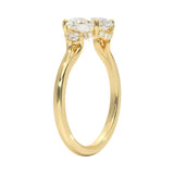 Detailed view of a high-quality D-color VVS1 oval moissanite center stone with GRI certification and sparkly round side stones handcrafted in Cape Town.