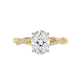 Luxury oval cut moissanite engagement ring with a twisted infinity pavé band in yellow gold ApolloGem South Africa.