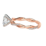 Close-up of a high-quality D-color VVS1 oval moissanite center stone on a shimmering pavé twisted shank.