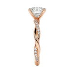 Close-up of a high-quality D-color VVS1 oval moissanite center stone on a shimmering pavé twisted shank.