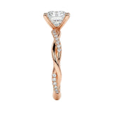 Close-up of a high-quality D-color VVS1 oval moissanite center stone on a shimmering pavé twisted shank.