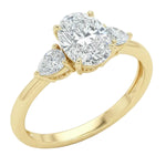 Classic oval and pear three-stone engagement ring ApolloGem showing the flattering elongating effect and polished gold band