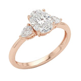 Elegant bridal jewelry stack featuring an oval and pear trilogy ring ApolloGem