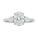Luxury oval cut moissanite engagement ring in white gold with two elegant pear cut side stone accents ApolloGem South Africa