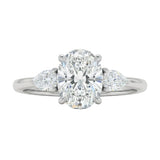 Luxury oval cut moissanite engagement ring in white gold with two elegant pear cut side stone accents ApolloGem South Africa
