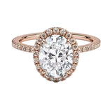 Rose gold ring with a large diamond and smaller diamonds around on a white background