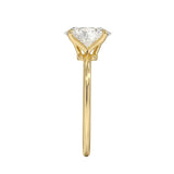 Symmetrical top-down view of an oval moissanite solitaire in a polished yellow gold setting.