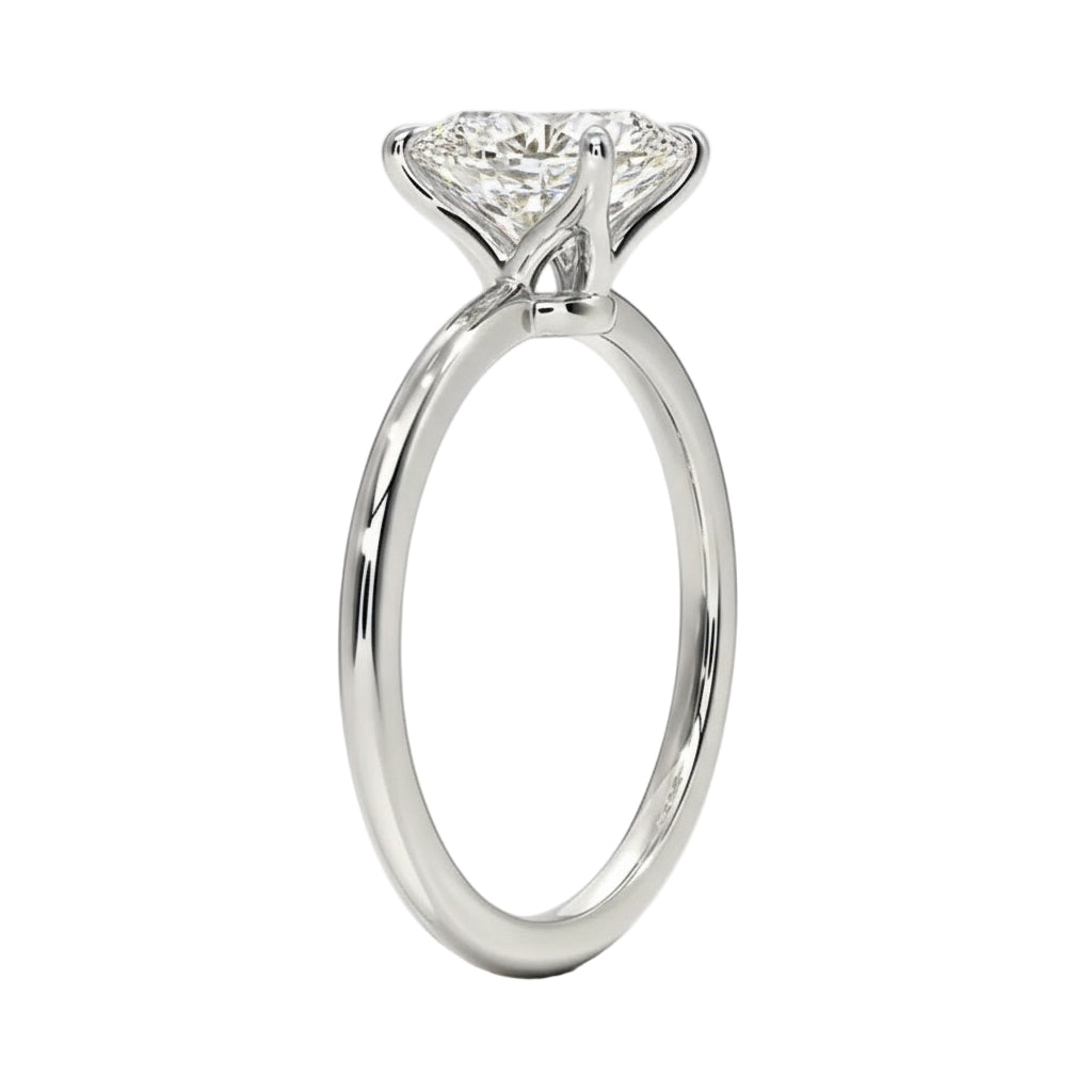 Detailed side view of the oval moissanite solitaire showing the 4-prong setting and round band.