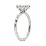 Detailed side view of the oval moissanite solitaire showing the 4-prong setting and round band.