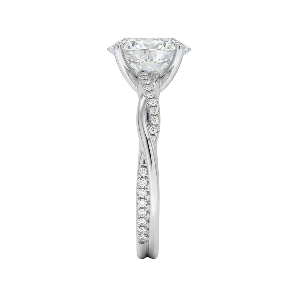 Top-down view of a D-color VVS1 oval stone in an asymmetrical white gold cat-claw setting.