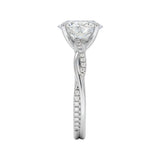 Top-down view of a D-color VVS1 oval stone in an asymmetrical white gold cat-claw setting.