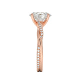Top-down view of a D-color VVS1 oval stone in an asymmetrical rose gold cat-claw setting.