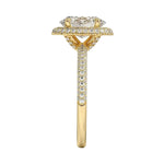 Symmetrical top-down view of an oval moissanite halo ring in polished yellow gold.