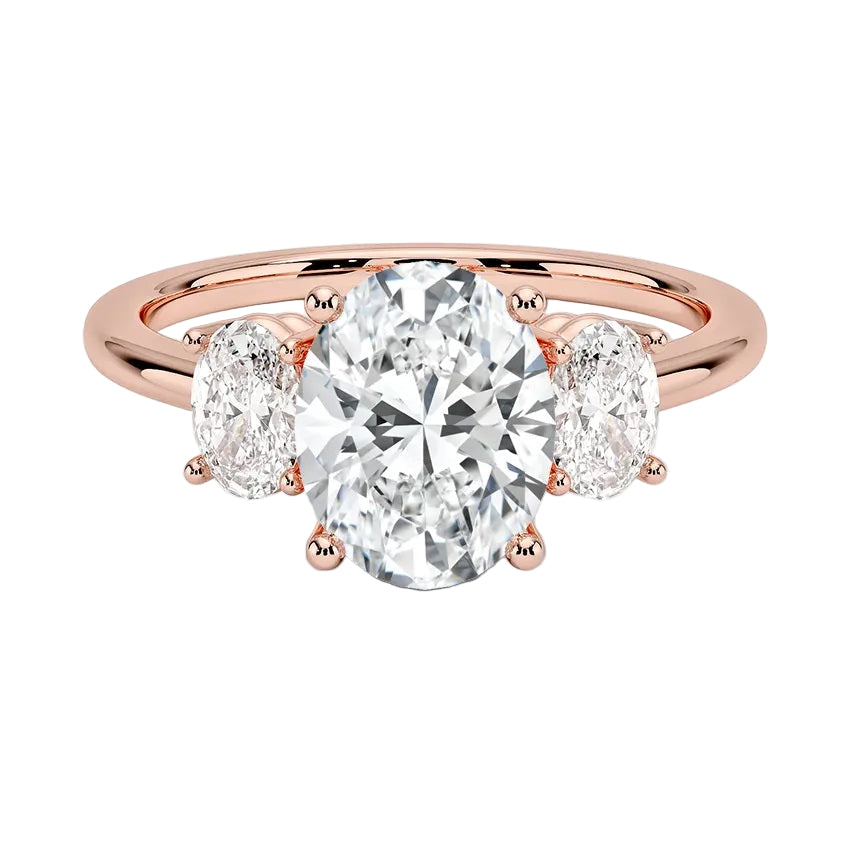 Oval brilliant cut moissanite trilogy engagement ring in rose gold ApolloGem.