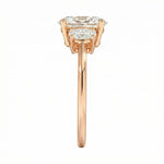 Top-down view of a D-color VVS1 graduated three-stone oval moissanite ring.