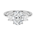 Oval brilliant cut moissanite trilogy engagement ring in white gold ApolloGem.