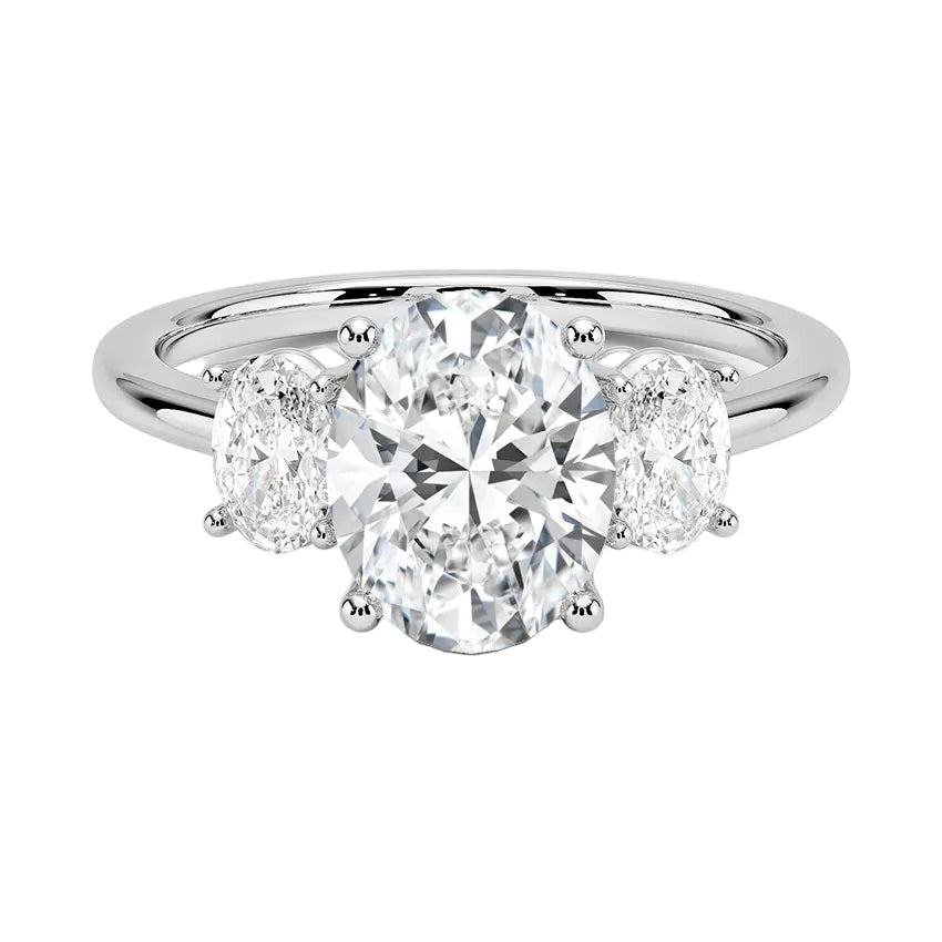 Oval brilliant cut moissanite trilogy engagement ring in white gold ApolloGem.