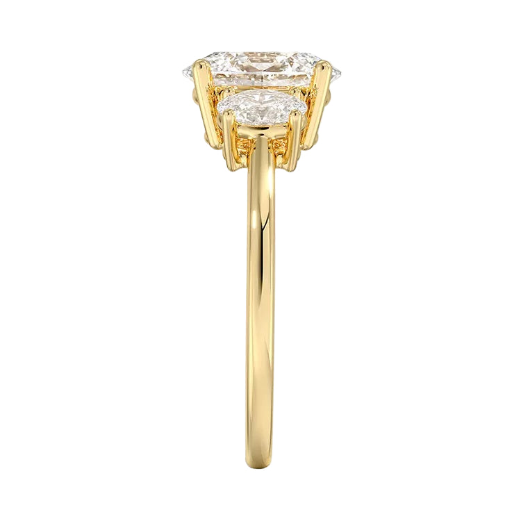 Top-down view of a D-color VVS1 graduated three-stone oval moissanite ring.