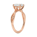 Symmetrical top-down view of an oval moissanite solitaire on a decorative twisted rose gold band.
