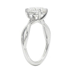 Symmetrical top-down view of an oval moissanite solitaire on a decorative twisted white gold band.