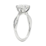 Symmetrical top-down view of an oval moissanite solitaire on a decorative twisted white gold band.