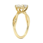 Symmetrical top-down view of an oval moissanite solitaire on a decorative twisted yellow gold band.