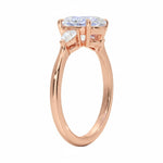 Three stone oval moissanite ring with pear shaped accents rose gold 18k