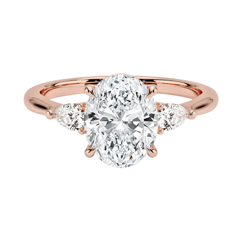 Rose gold ring with a large diamond and smaller diamonds on the sides against a white background