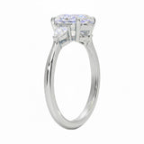 Close up of oval and pear cut moissanite stones in four prong setting