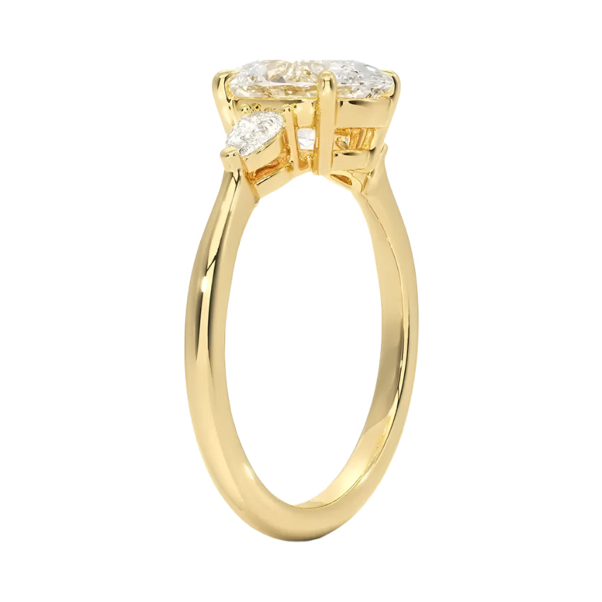 Three stone oval moissanite ring with pear shaped accents yellow gold 18k