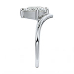 Detailed side view showing the suspended 4-prong setting and floating moissanite effect.
