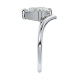 Detailed side view showing the suspended 4-prong setting and floating moissanite effect.