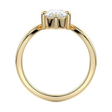 Symmetrical top-down view of a pear-cut moissanite solitaire on a polished V-shaped gold band.