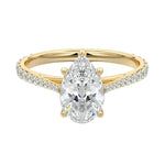  Sculpted five-claw pear cut moissanite cathedral ring with a tapered pavé gold band ApolloGem.