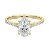  Sculpted five-claw pear cut moissanite cathedral ring with a tapered pavé gold band ApolloGem.