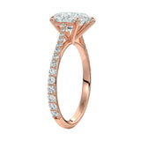 Top-down view of a D-color VVS1 pear stone in a rose gold tapering pavé cathedral setting.