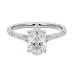Sculpted five-claw pear cut moissanite cathedral ring with a tapered pavé gold band ApolloGem.